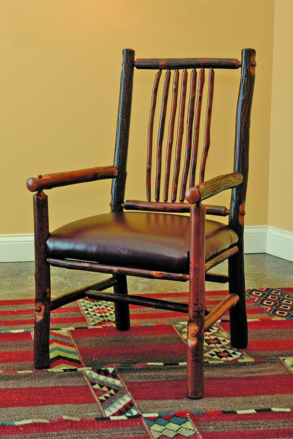 craft arm chair with rustic log frame and leather seat