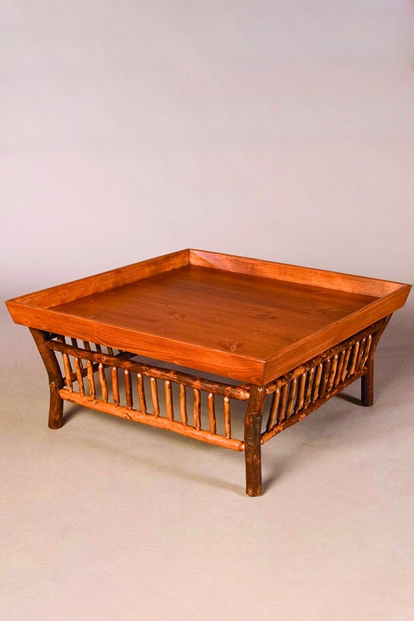 jonas ridge cocktail table with tray top and branch accents