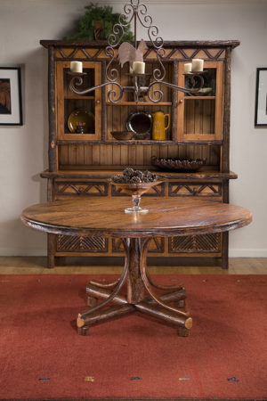 savannah round dining table with mosaic hutch behind