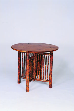 round gate leg table with pole accents