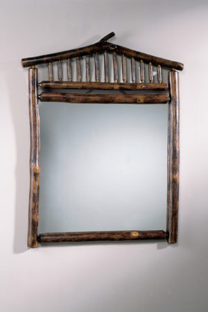 square mirror with peaked rustic wood frame on wall