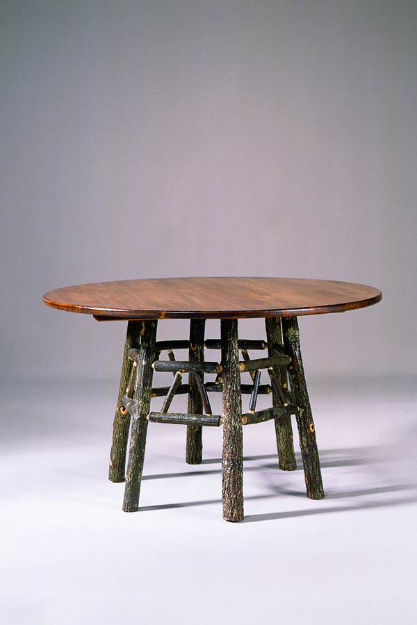 round dining table with 6 rustic bark log legs