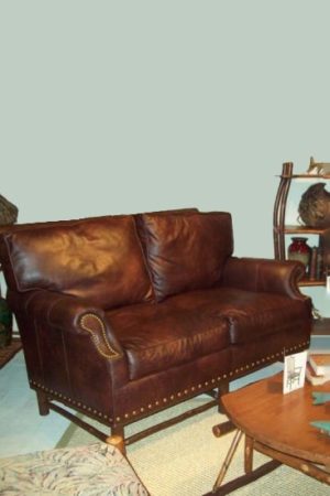 loveseat with dark brown leather upholstery - rustic sofa