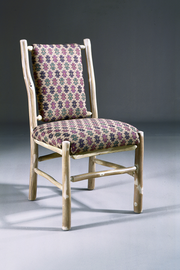 western side chair in wheat finish with patterned upholstery