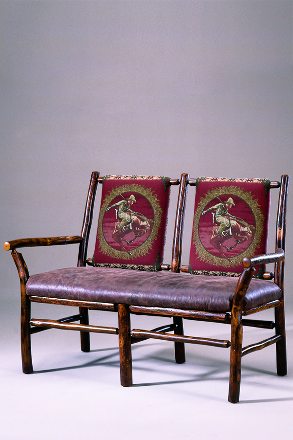 hickory settee with leather seat and cowboy design fabric