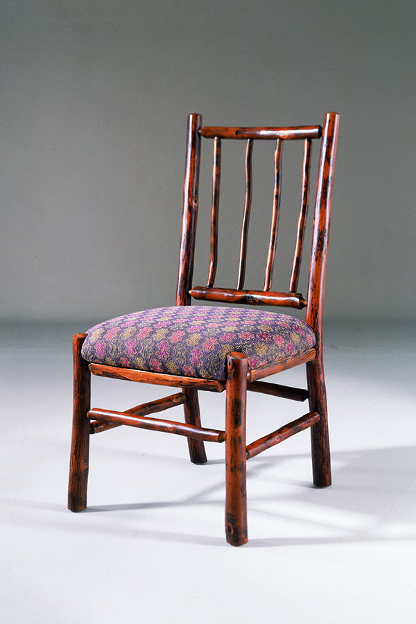 Side chair with pole back and patterned fabric seat