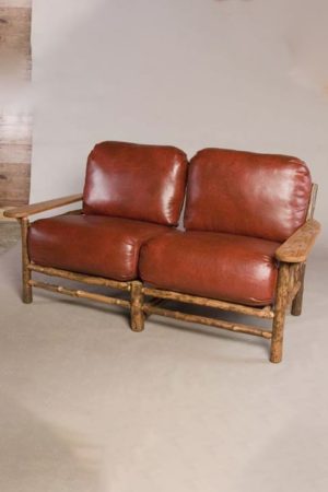 club love seat with leather upholstery - rustic sofa
