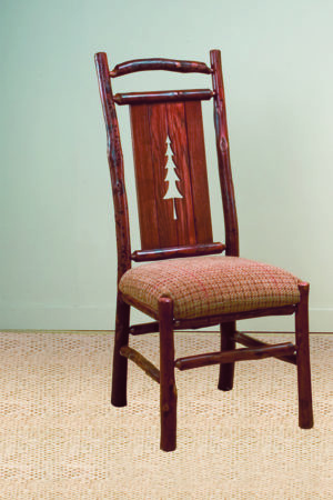 pine tree side chair with carved tree back and red plaid seat cushion