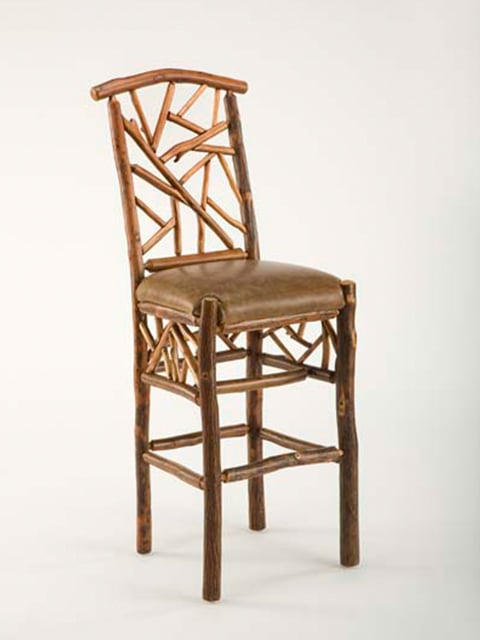 woodsman bar chair with leather seat and branch accents on back