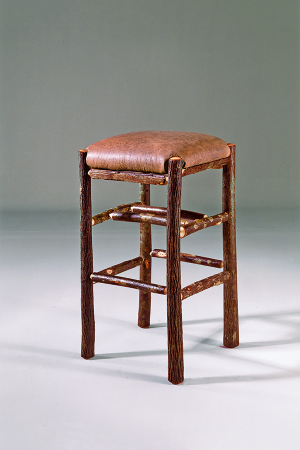 bar stool with rustic log legs and leather seat