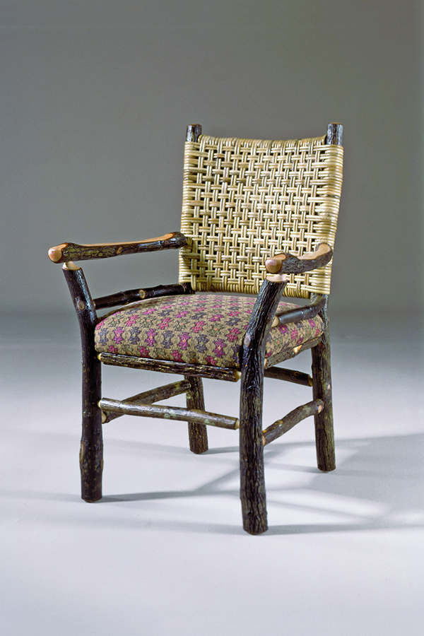 lawenda arm chair with woven caned back and patterned fabric seat