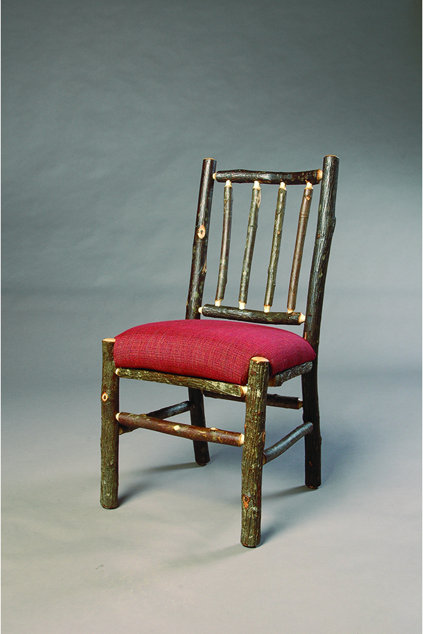 side chair with rustic bark legs, pole back, and red upholstered seat