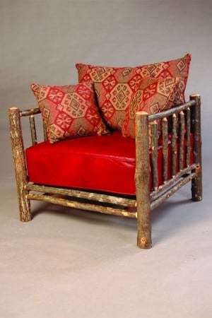 lounge chair with log frame and red cushions
