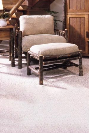 club chair and ottoman with natural bark finish and taupe fabric upholstery